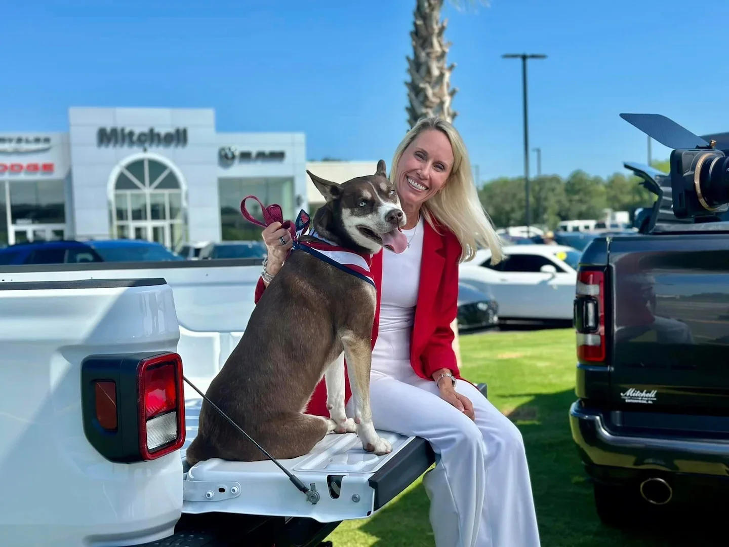 woman with a dog at Mitchell Chrysler Dodge Jeep Ram in Enterprise AL